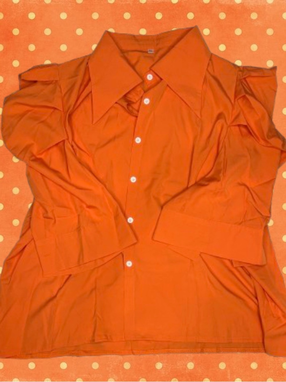 Orange button-up blouse with ruffled sleeves